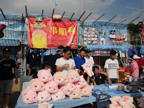Fa Hui Lunar New Year Fair stall selling stuffed toy pigs