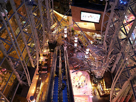 Looking down at a multistory escalator in Langham Place