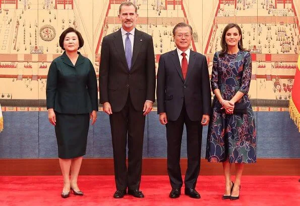 Queen Letizia wore Temperley London Eggshell floral embroidery tulle midi dress and Hugo Boss Dadoria beltedsheath dress