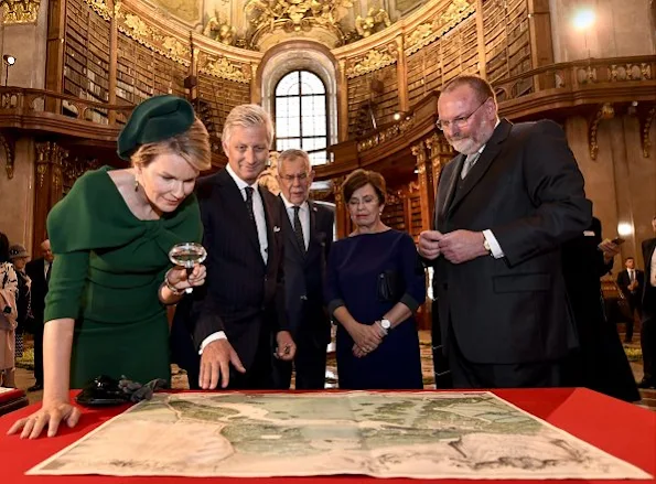 Queen Mathilde, Alexander Van der Bellen of Austria and his wife Doris Schmidauer. Mathilde wore Natan dress