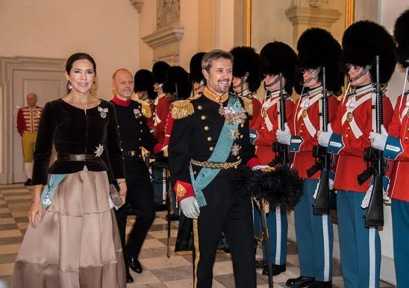 Crown Prince Frederik and Crown Princess Mary attended New Year reception. Princess Mary wore satin skirt