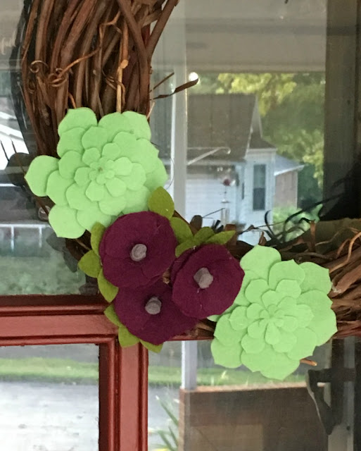 I used my Cricut Maker to make a Felt Flower Fall grapevine wreath.