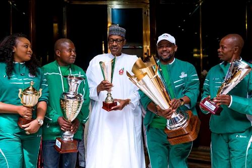 aa Photos: President Buhari receives National Open Water Swimming Competition Trophy