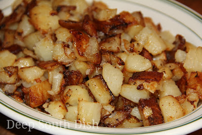 Southern style, smothered fried potatoes with onion, are cubed peeled russets, that are first steamed, then pan-fried in bacon drippings to crisp and turned, resulting in a tender inside, but with crispy outer edges.