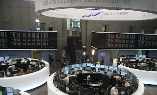 The contemporary stock-exchange in Frankfurt, whose spacy appearance and clean order look like the bridge from Star Trek, although the room is mostly just a backdrop for reporting and the actual operations go on in other facilities around the city