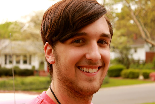 A close up of a man smiling for the camera