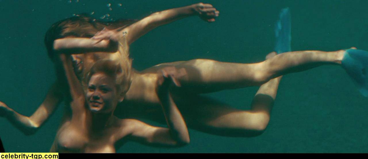 Kelly Brooke underwater completely nude swimming with her girl friend. 