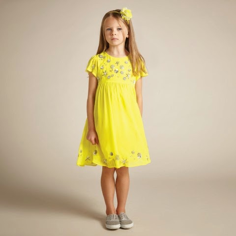 As bright as sunshine. She'll standout with style in this chiffon ...