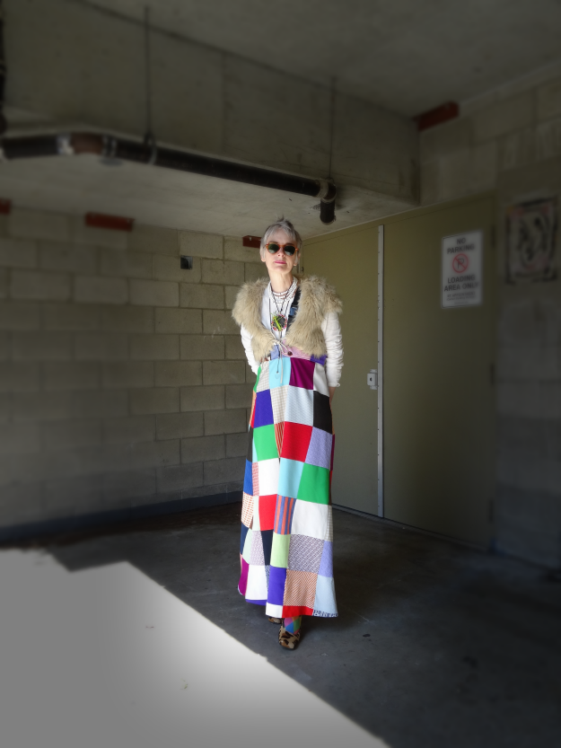 Bag and a Beret, Mel Kobayashi in patchwork skirt with uni-suspender