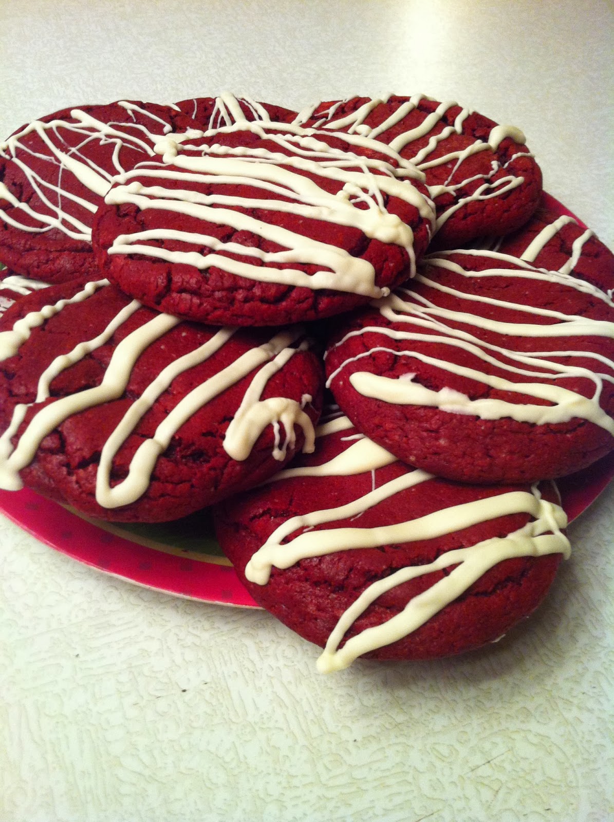 Sweet Red Velvet Cheesecake cookies with white chocolate drizzle