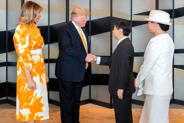 Melania Trump wore Dries van Noten floral print cotton coat. Naruhito and Empress Masako at Tokyo hotel