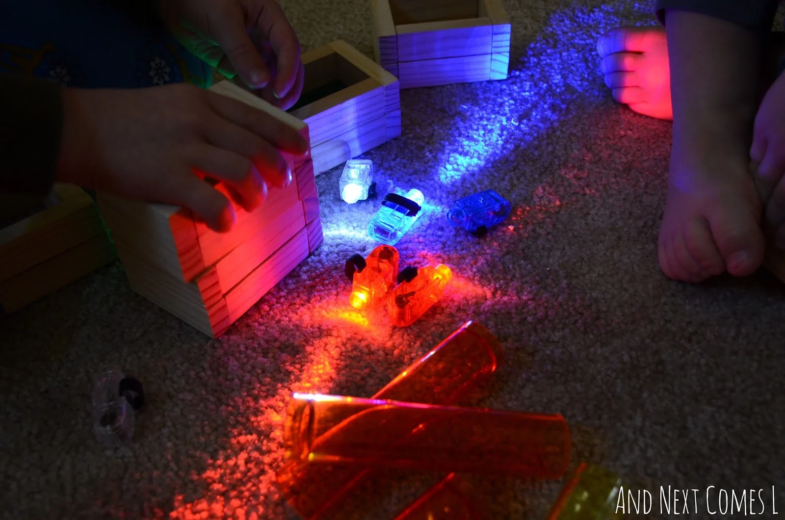 Light play for kids using finger lights and translucent objects from And Next Comes L