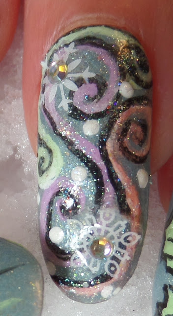 swirly snowflake nail design
