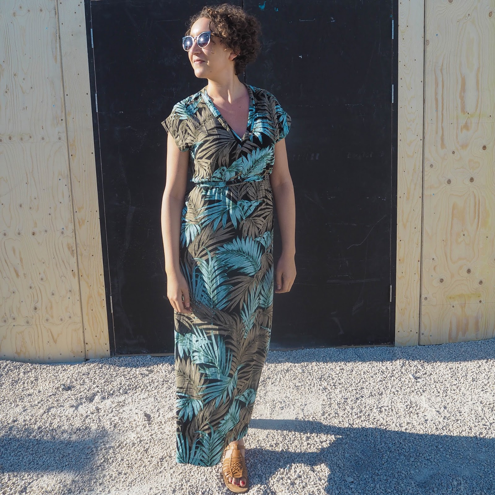 Fashion blogger wearing palm print maxi dress