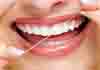 <Img src ="Hilo-dental-entre-dientes.jpg" width = "128" height "70" border = "0" alt = "Fotos del hilo dental">