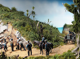 Diorama of 19th-century soldiers fixing a landslide on a track. In the foreground is a large cabbage tree.