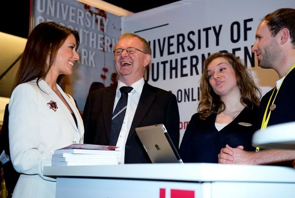 Princess Marie arrived at the fair with the Rector of the University of Southern Denmark. wore blazer and black trousers, diamond earrings