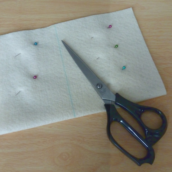 Pinning to secure the pieces and then cutting the felt bag to size