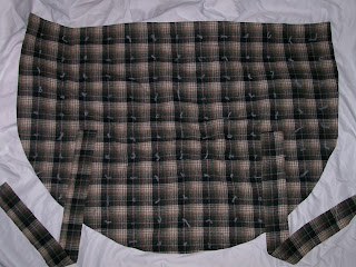 Hood laid out flat, with tufting. Hood laid out flat, with tufting.