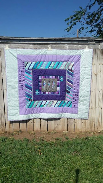 Aqua and purple feather round robin quilt