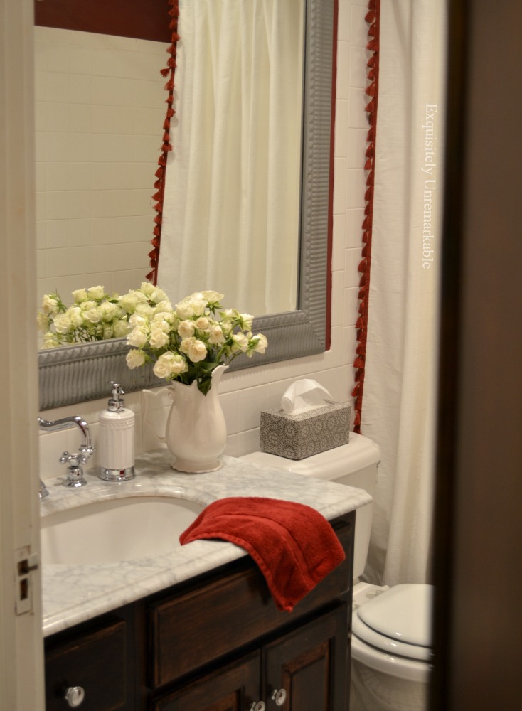 Cottage Style Bathroom with red and white shower curtain