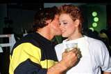 Schwarzenegger with his arm around Brigitte Neilsen