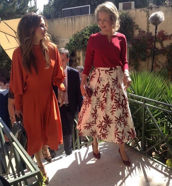 Diane von Furstenberg Flirty Elaphe clutch, Natan dress, dress made by "regular" Jordanian women with local fabrics