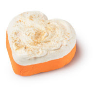 A gold and orange coloured heart bubble bar laid down on a white background. 