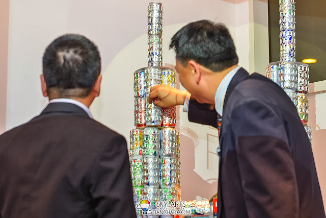 Final touch by Mr Vincent Wong Wai Sang, Political Secretary, Minister in Prime Minister’s Department to complete the sculpture of Petronas Twin Towers which made of aluminium pop tabs