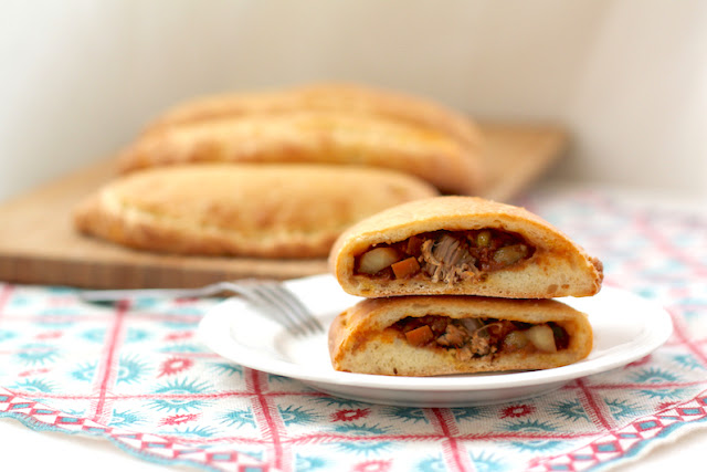 Food Lust People Love: Spicy Beef Curry Calzones feature a thick rich beef curry inside and a soft naan bread outside. They are like eating your curry by scooping it up with naan, but in a less messy, more portable way.