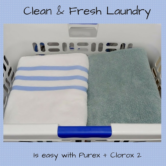 clean and folded towels in laundry basket