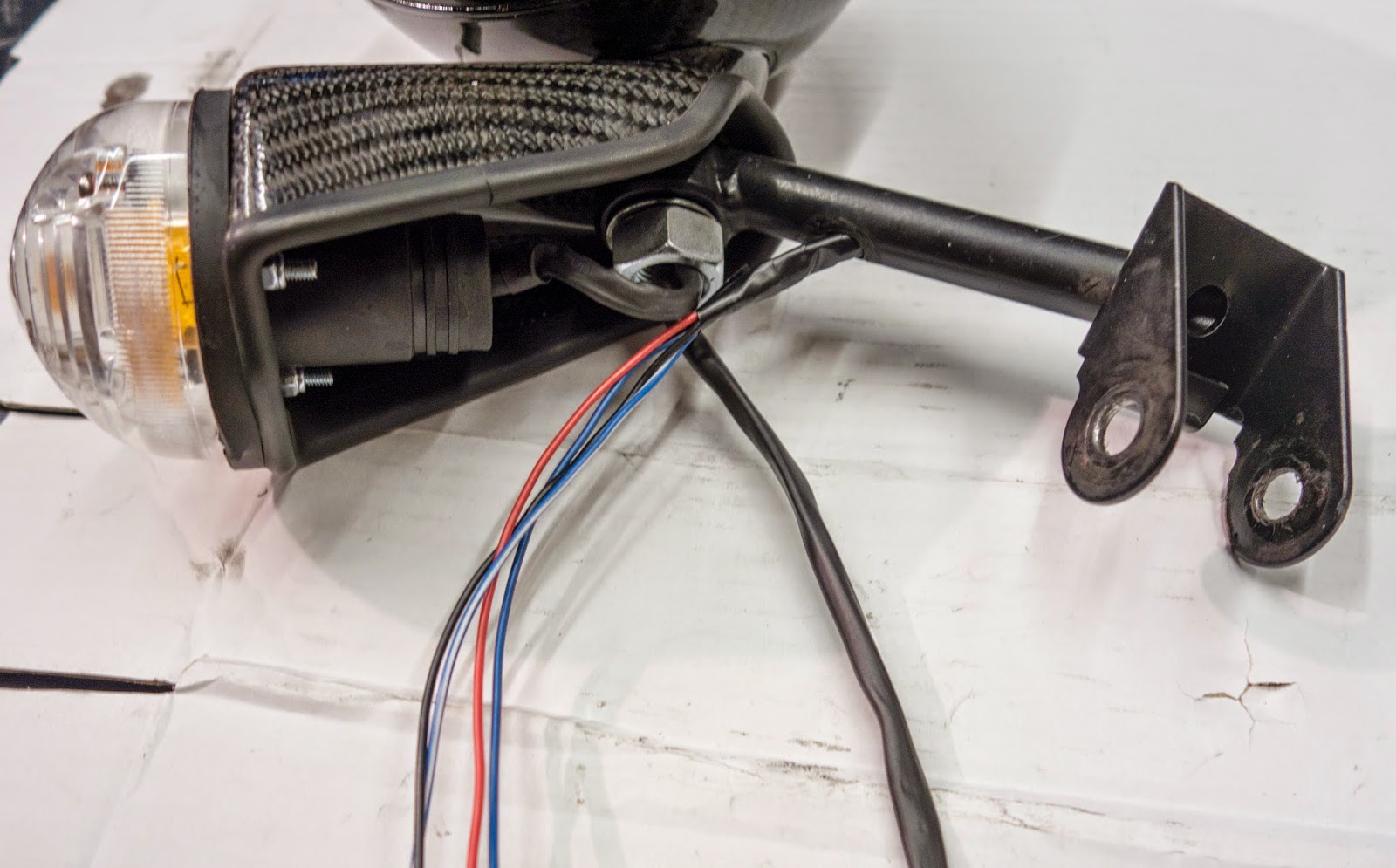Thread headlight wiring through mounting bracket
