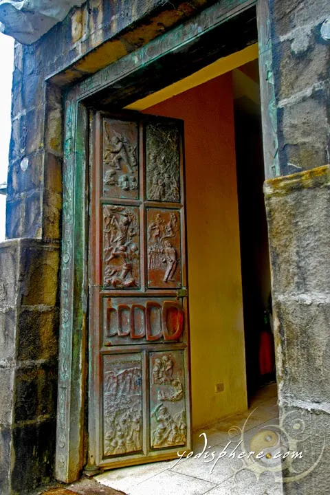 Carved doors going inside the Memorial Cross