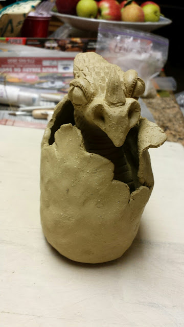 Dragon hatching from egg, pottery/ceramic, in progress, by Lily L.