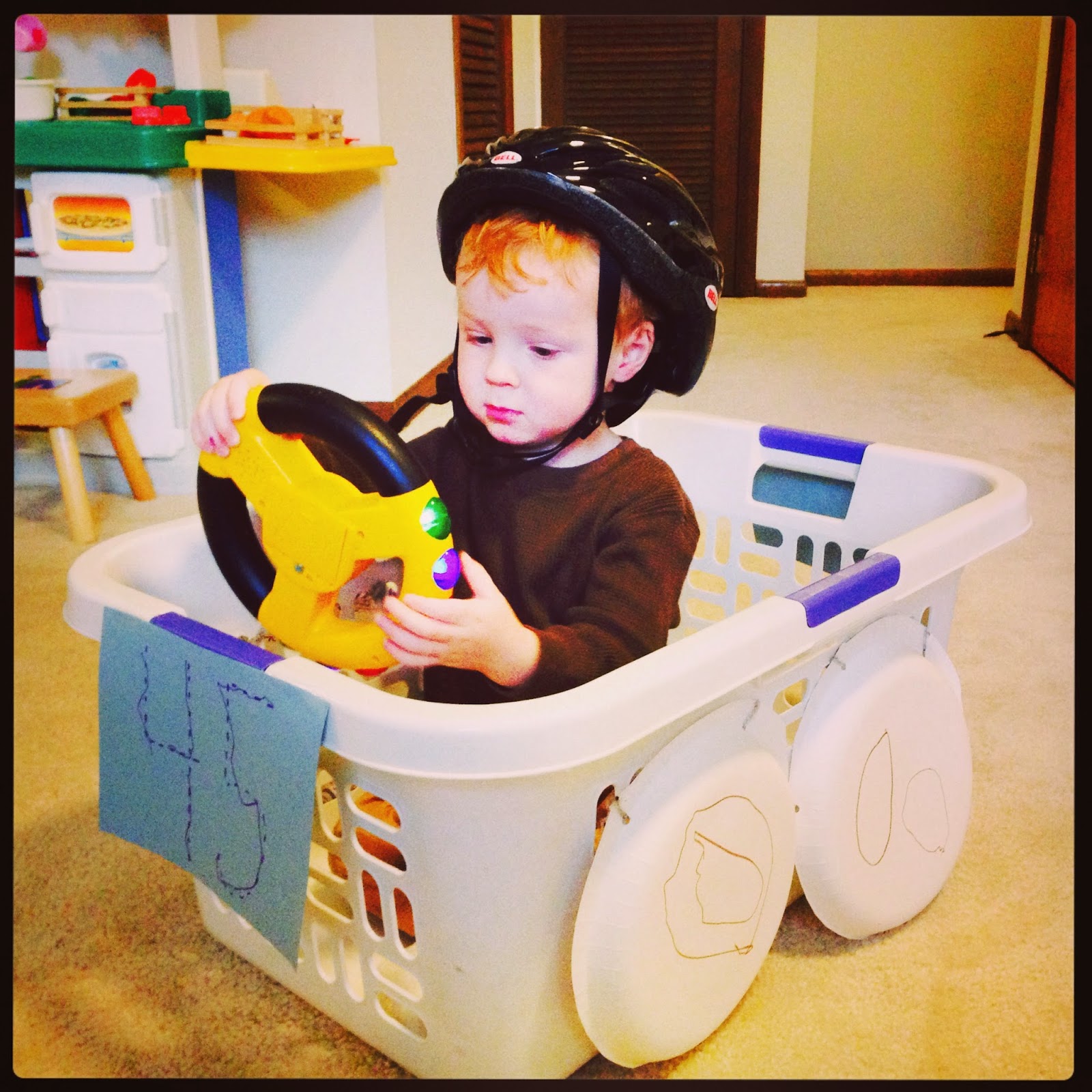 Teach. Play. Love. Laundry Basket Race Car