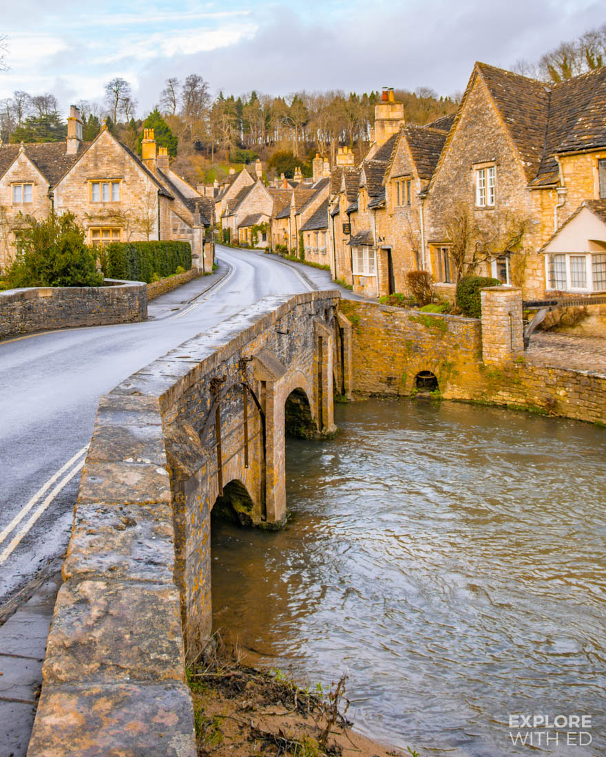The classic view of England's prettiest village Castle Combe (in The Cotswolds) from the river bridge