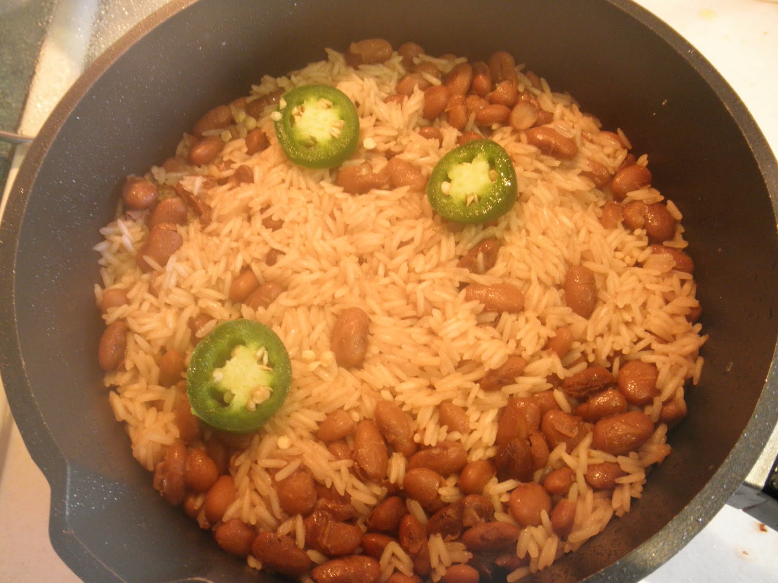 Haitian Creole Making Mixed Rice with Dry Beans.