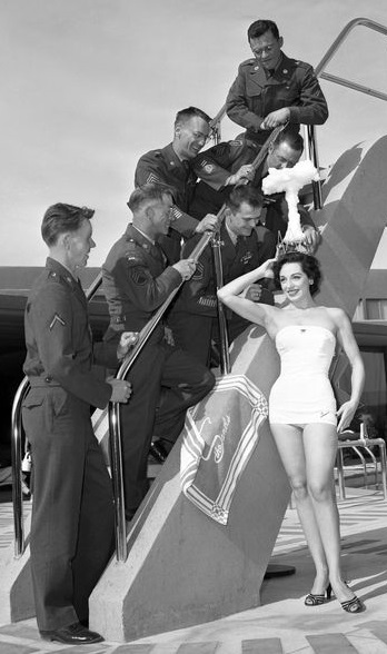 Linda Lawson, Atomic Beauty Queen, posing with soldiers