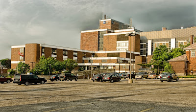 The Orillia Soldier's Memorial Hospital and the main parking area under stormy skies