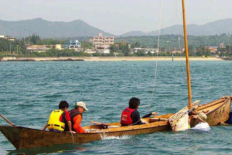 bailing water, sabani boat, straw hat