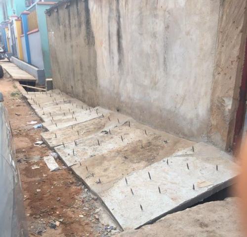 1 Photos: To hinder unwelcome guests, Landlady allegedly fixes sharp iron nails in front of her house in Lagos