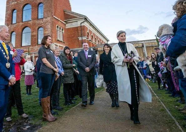 Countess of Wessex wore Prada wool coat and Victoria Beckham Tweed side drape midi skirt for visit Netley Hospital