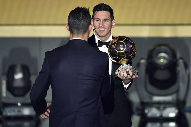 Winner: Messi is congratulated on his Ballon d'Or success by Ronaldo