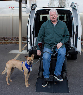 photo of Roland on the ramp of his new van