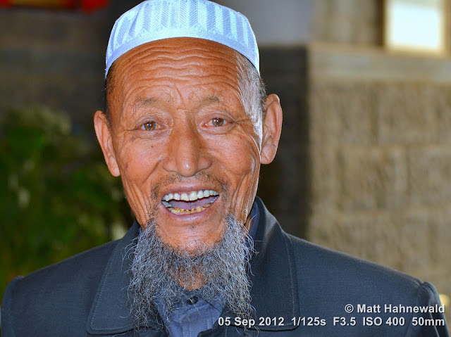 street portrait, headshot, China, Xi'an, Hui Muslims, Hui Muslim man, taqiyah, white skullcap, kufi, Muslim beard