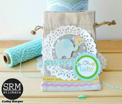 SRM Stickers Blog - A Baby Gift by Cathy - #baby #gift #doilies #stickers #punchedpieces #twine #lace #linenbag