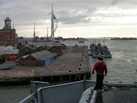 Standing on the edge of an aircraft carrier flight deck