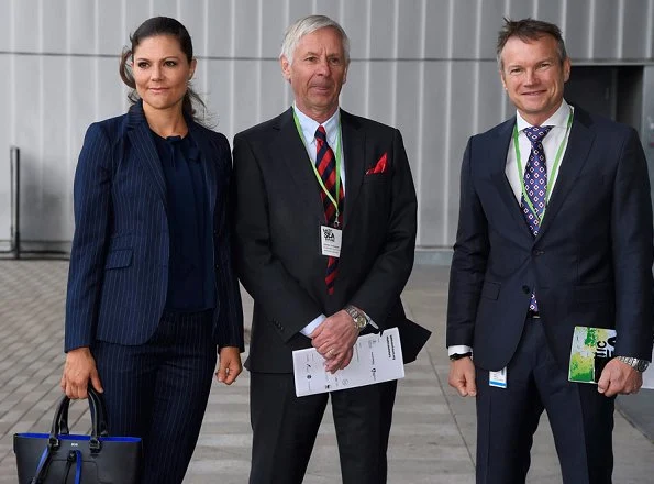 Crown Princess Victoria carried Dagmar Taylor Tote Bag, Ralph Lauren Suede Celia Pump and Malene Birger blouse. Charlotte Bonde Sthlm Louise Ribbon Earrings