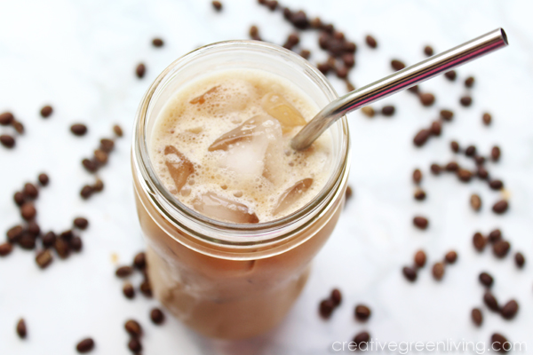 iced latte in a mason jar with a stainless steel straw