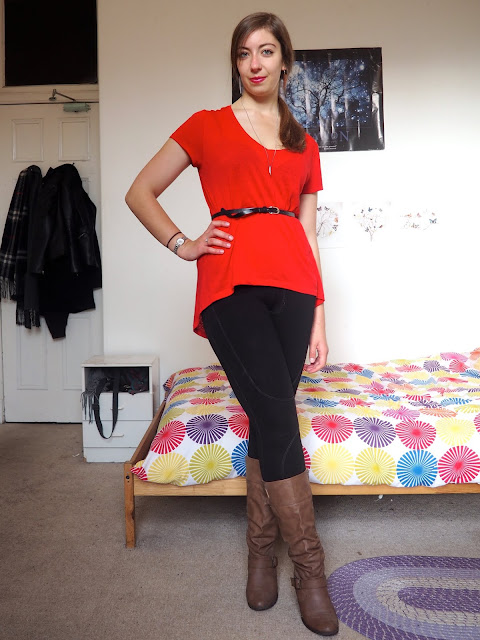 Disneybound Gaston inspired outfit of belted red top, black leggings and tall brown leather boots